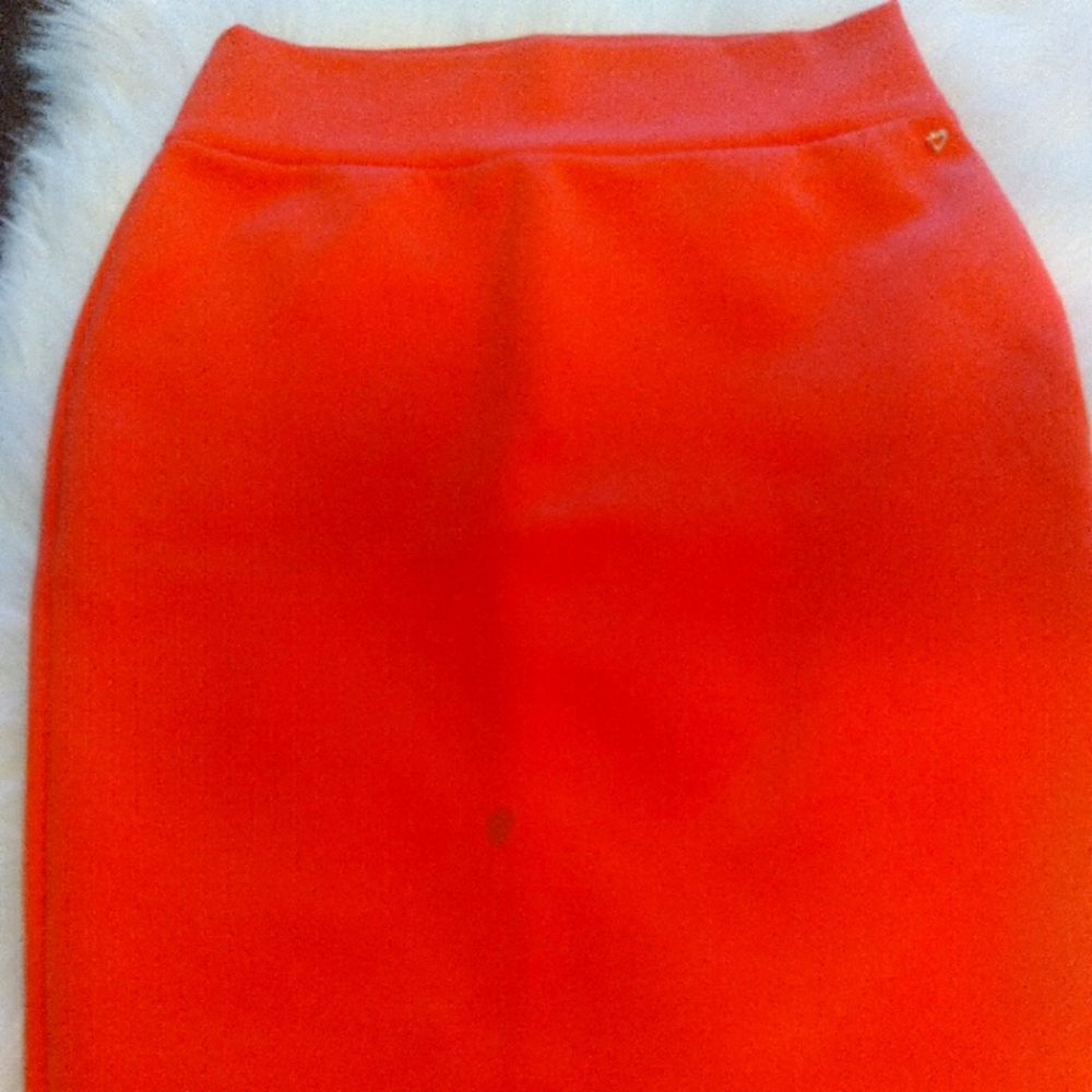 Thalia Sodi's fitted pencil skirt. Color Coral, size large 10-12 (small stain).
